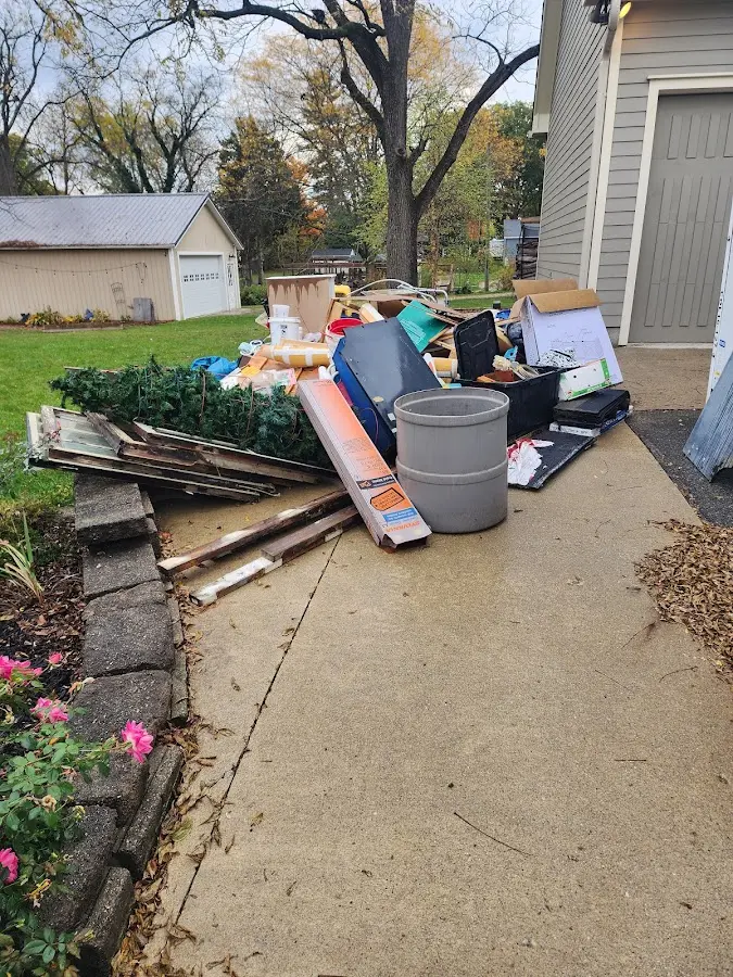 Dumpster being loaded with debris for Estate Cleanout Dumpster Rental in New Philadelphia